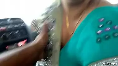 Indian babe in green sari takes big cock in hand and mouth in the car