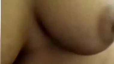 Chubby shy Indian girl showing round boobs to lover