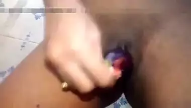 Indian girl plays XXX games on camera shoving an eggplant in her sex hole