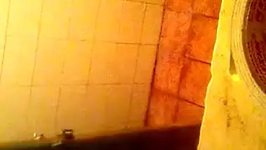 Girl spying on her stepmom having nude bath